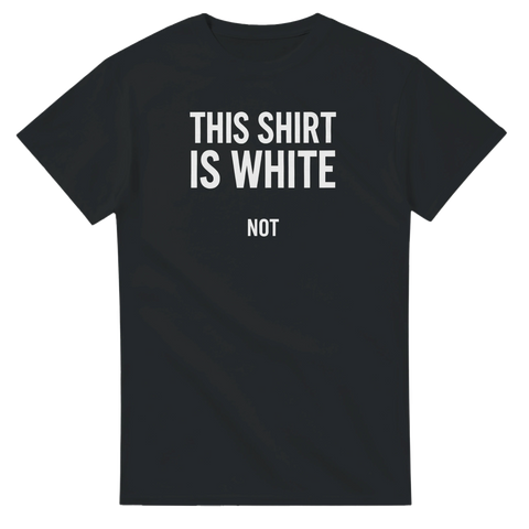 Svart t-shirt med vit text “THIS SHIRT IS WHITE” och liten text “NOT” – humoristisk och ironisk design.