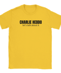 Charlie Hebdo let's talk about it" text på gul t-shirt, svart typografi.