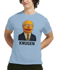Muppknugen-tryck med Bert i kostym och slips, samt texten "KNUGEN", på en ljusblå t-shirt.