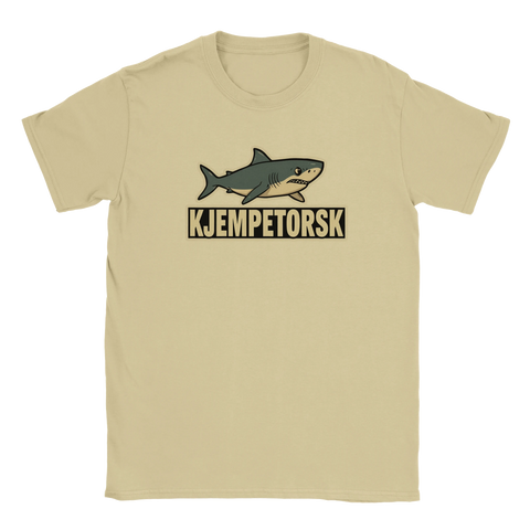 Beigefärgad t-shirt med lekfull illustration av en haj ovanför ordet Kjempetorsk