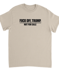 Svart text "FUCK OFF, TRUMP. NOT FOR SALE" på beige t-shirt.