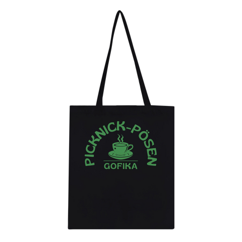 Svart tygkasse med grönt picknickmotiv och texten Picknick-Påsen Gofika