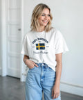 100% Swedish Nordic Heritage" tryck med svensk flagga på vit t-shirt.