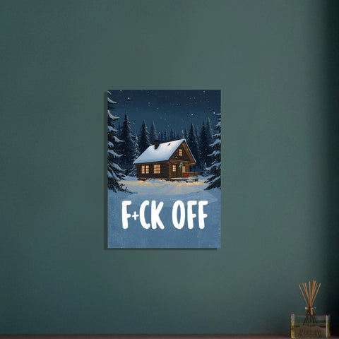 Poster med motiv av en stuga i skogen täckt av snö och texten F+ck Off placerad centrerat i motivets nederkant.