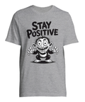 Tecknad galen apa med text "STAY POSITIVE" på grå t-shirt.