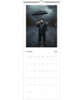 Kim Jong-un med paraply i regn på väggkalender 2026, satirisk design.