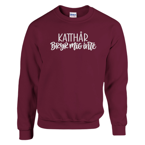 Vinröd sweatshirt med texten ”Katthår – bryr mig inte”.
