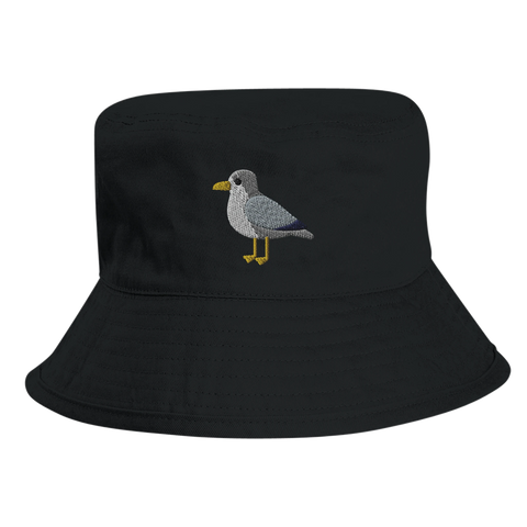 Detaljerat broderi av en fiskmås på svart fiskarhatt