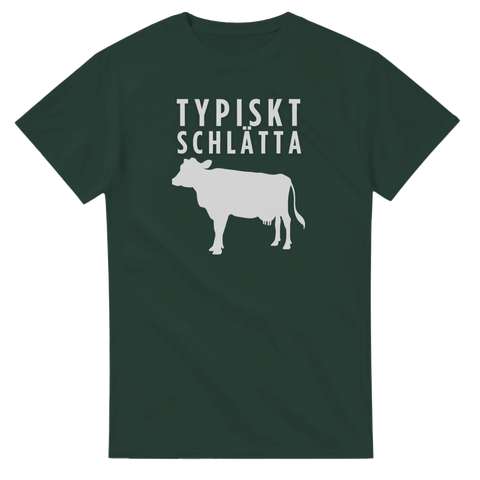 Vitt "Typiskt Schlätta" text och ko-silhuett på mörkgrön t-shirt.