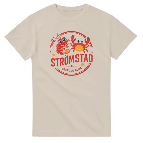 Grafiskt tryck av havsdjur i rött och orange på sandfärgad t-shirt