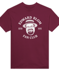 Edward Blom Fan Club-tryck med karikatyr av Blom i stråhatt, på vinröd T-shirt.