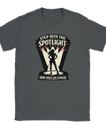 Svart silhuett av kvinna i rampljus med text "STEP INTO THE SPOTLIGHT AND OWN THE STAGE" på mörkgrå t-shirt.