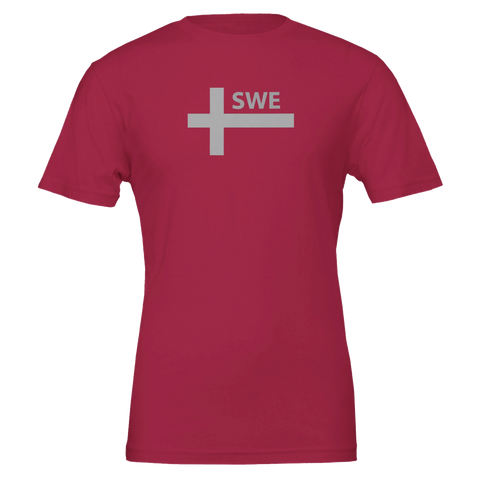 Mörkröd t-shirt med en modern tolkning av det svenska korset i grått