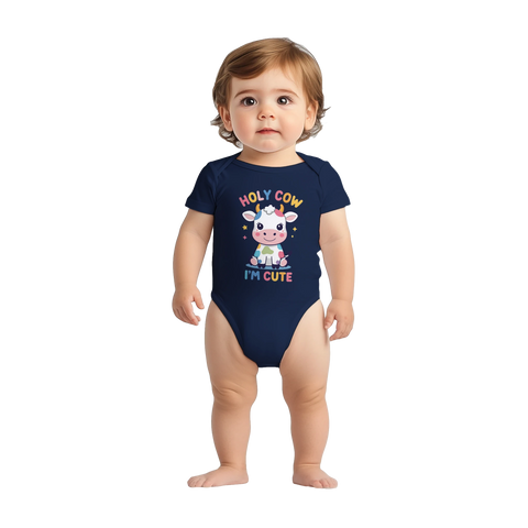 Färgglad tecknad ko med texten "Holy Cow I'm Cute" på marinblå babybody.