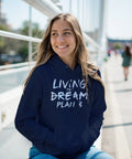 Living the Dream Plan B" vit text i penseldragsstil på marinblå hoodie med huva och magficka.