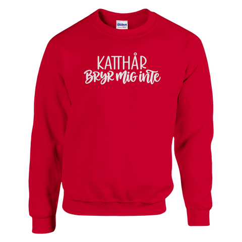 Röd sweatshirt med texten ”Katthår – bryr mig inte”.
