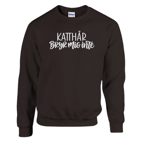 Brun sweatshirt med texten ”Katthår – bryr mig inte”.