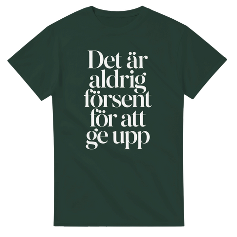 Mörk humoristisk text i grafisk design på skogsgrön t-shirt