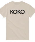 Beigefärgad t-shirt med kaxigt budskap i kraftig svart typografi