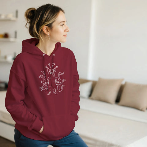 Vitt streckritat tentakelmonster med stora ögon på en vinröd hoodie.
