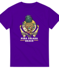Lila t-shirt med motiv av en dödskalle formad som en ananas på stranden
