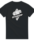 Humoristisk T-shirt med texten Fetknopp och en tecknad rund maskot som springer – perfekt rolig present eller partytröja.