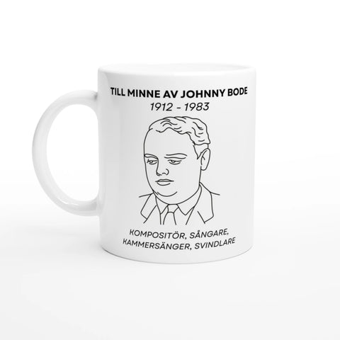 Vit mugg med linjeteckning av Johnny Bode och text till hans minne