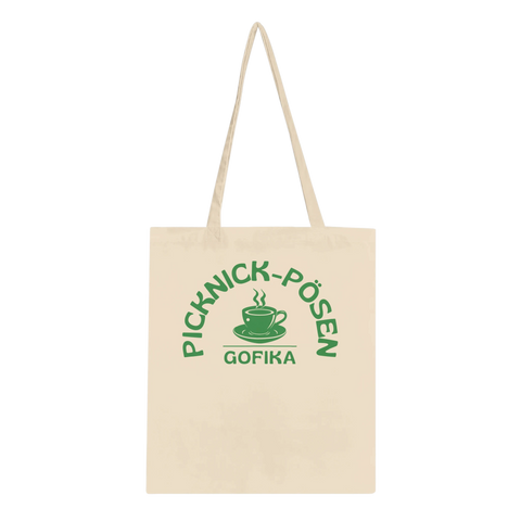 Naturfärgad tygkasse med grönt picknickmotiv och texten Picknick-Påsen Gofika