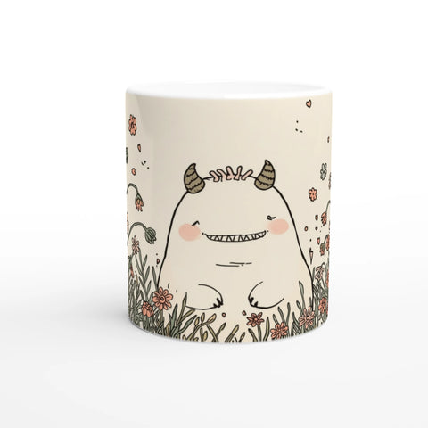 Mugg med blommor och ett troll som parodierar mumin. 