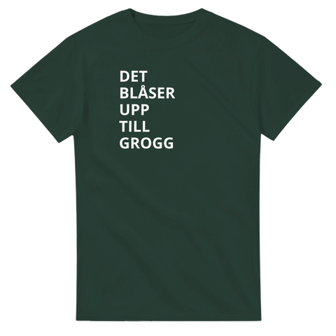 Rolig t-shirt med texten “Det blåser upp till grogg” i stilren vit typografi – perfekt för fest och after work.
